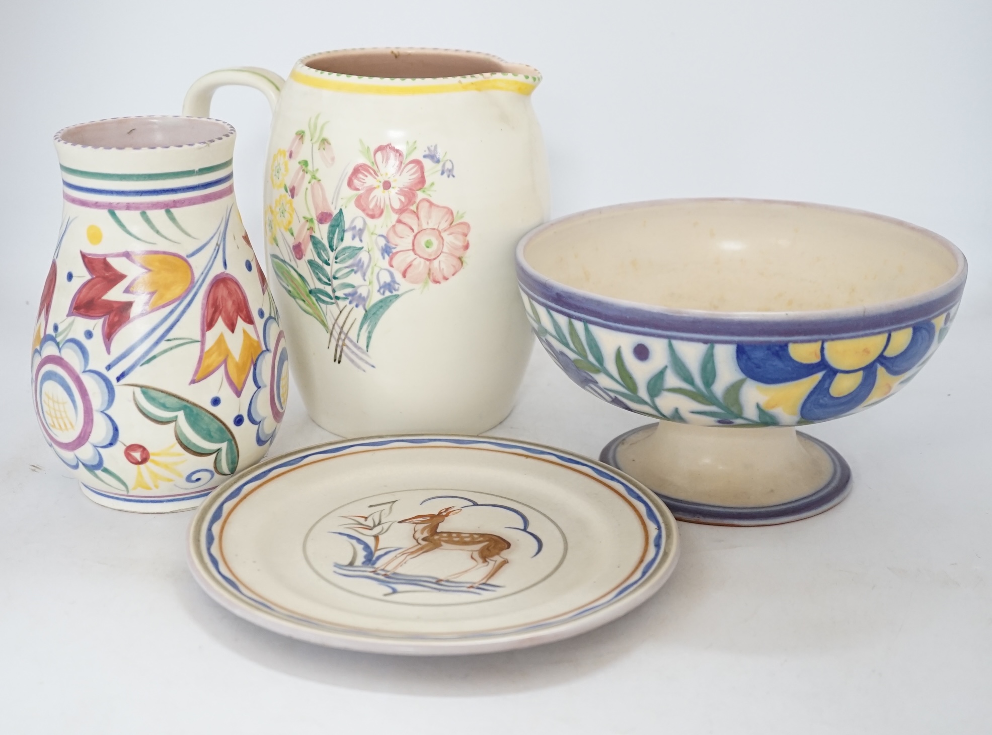 Eleven items of Poole pottery, from 1930’s to 50’s, including vases, jugs, mug and pedestal dish and pot and cover, tallest 19.5cm high. Condition - fair to good